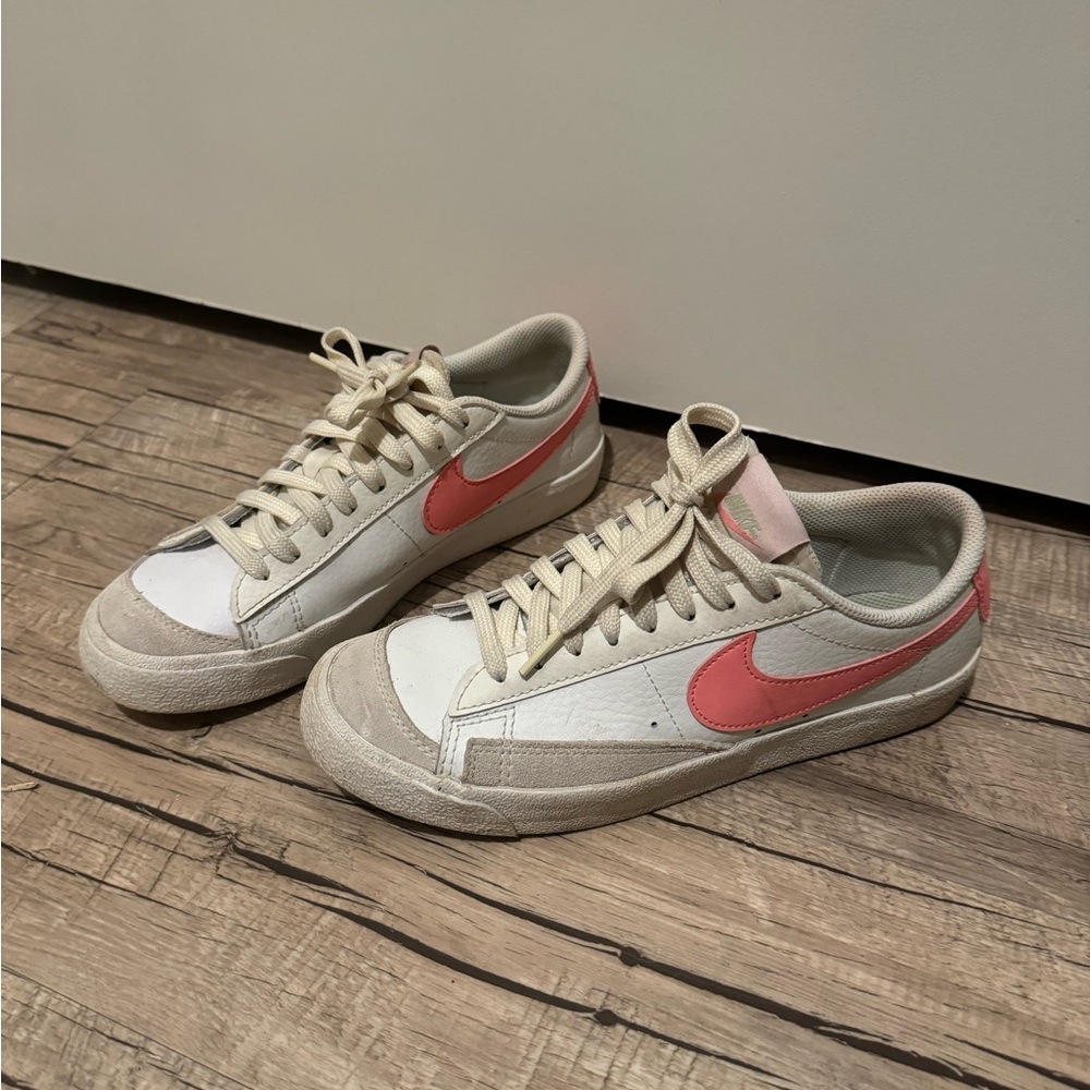 White with pink Nike shoes